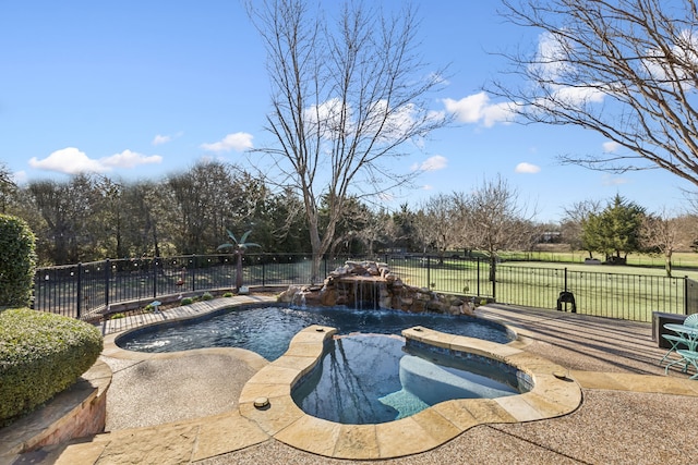 view of swimming pool featuring fence private yard and a pool with connected hot tub