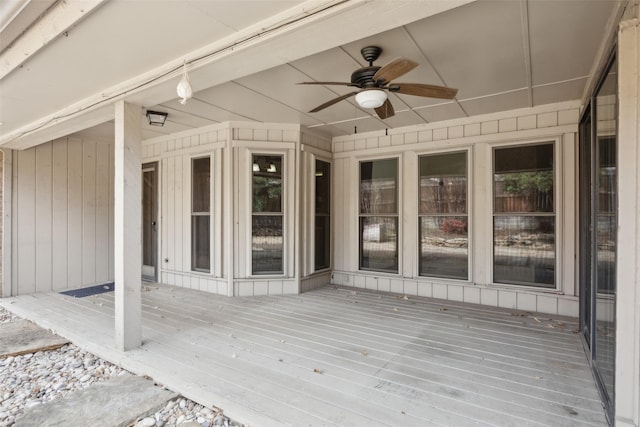 wooden deck featuring ceiling fan