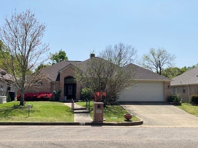 608 Paloma St, Tyler, TX 75703 - single story home with central AC, a front yard, brick siding, a garage, and driveway