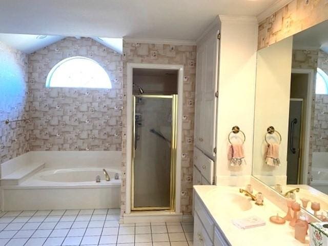 full bathroom featuring a stall shower, tile patterned flooring, crown molding, vanity, and a bath