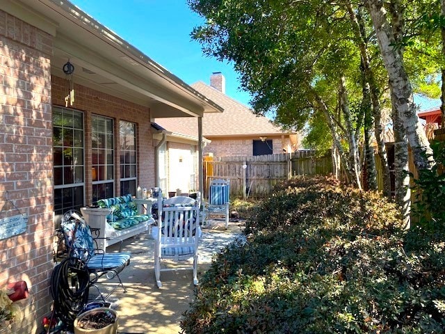 view of patio with fence