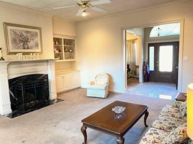 608 Paloma St, Tyler, TX 75703 - living room featuring ornamental molding, ceiling fan, carpet, and a high end fireplace
