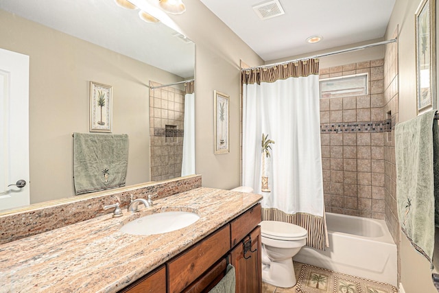 full bathroom with toilet, shower / bath combo, vanity, and visible vents