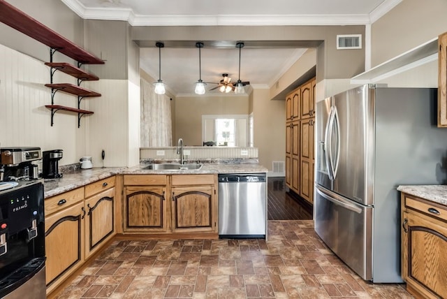 kitchen with visible vents, appliances with stainless steel finishes, ornamental molding, a sink, and a peninsula