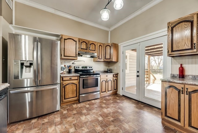 kitchen featuring stone finish floor, appliances with stainless steel finishes, crown molding, french doors, and under cabinet range hood