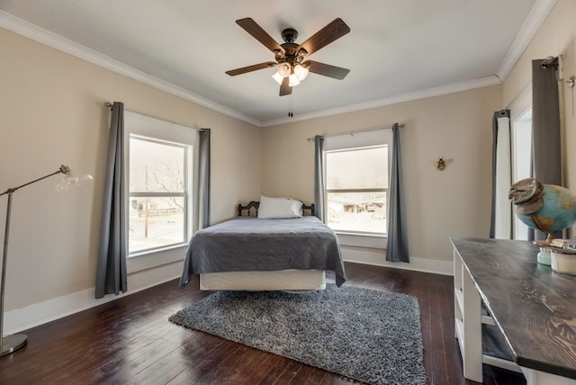 bedroom featuring baseboards, dark wood-style flooring, multiple windows, and crown molding