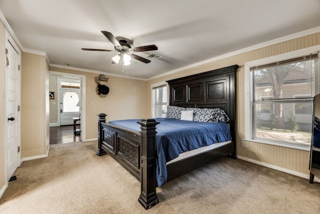 bedroom featuring visible vents, ornamental molding, light carpet, ceiling fan, and baseboards