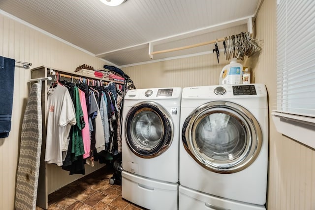 washroom featuring laundry area, independent washer and dryer, and stone finish flooring