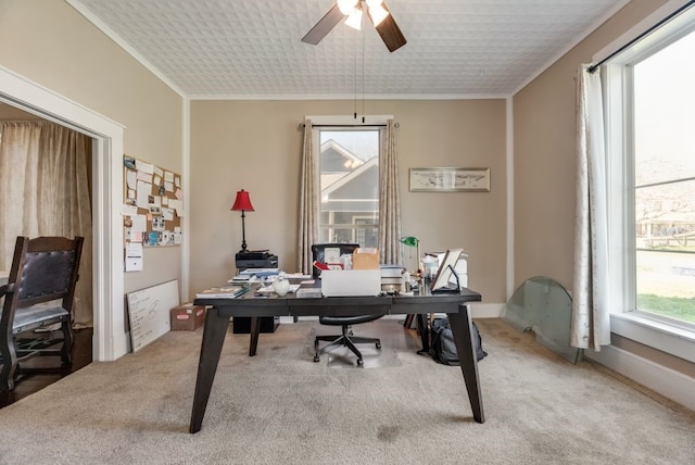 office area featuring ornamental molding, ceiling fan, and carpet floors