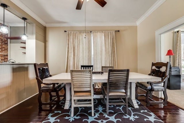 dining room featuring ceiling fan, ornamental molding, and wood-type flooring