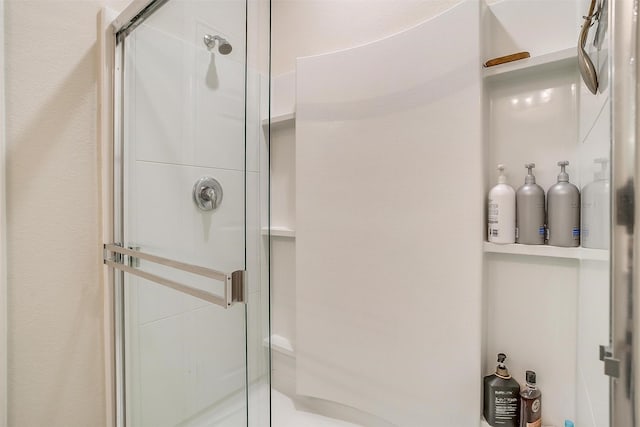 full bathroom featuring a shower stall