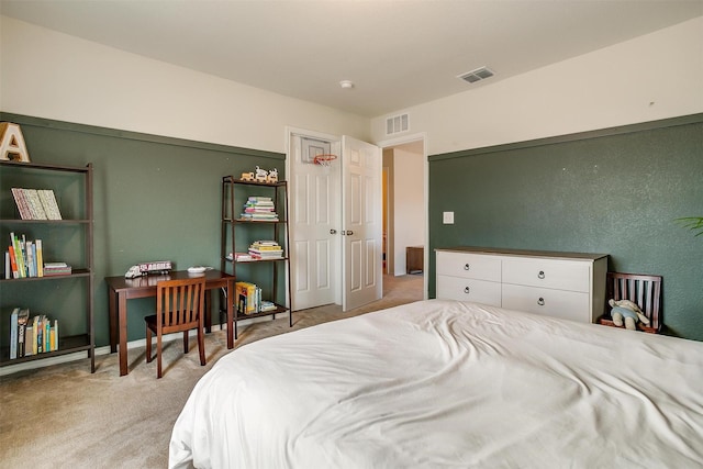 bedroom featuring carpet flooring and visible vents