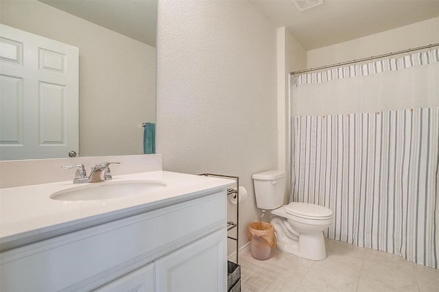 bathroom featuring curtained shower, visible vents, toilet, vanity, and tile patterned flooring