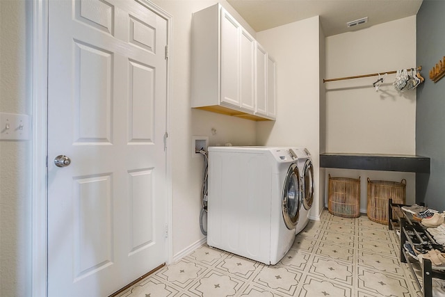 clothes washing area featuring cabinet space, visible vents, baseboards, light floors, and washing machine and dryer