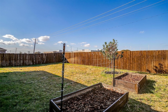 view of yard featuring a garden and fence