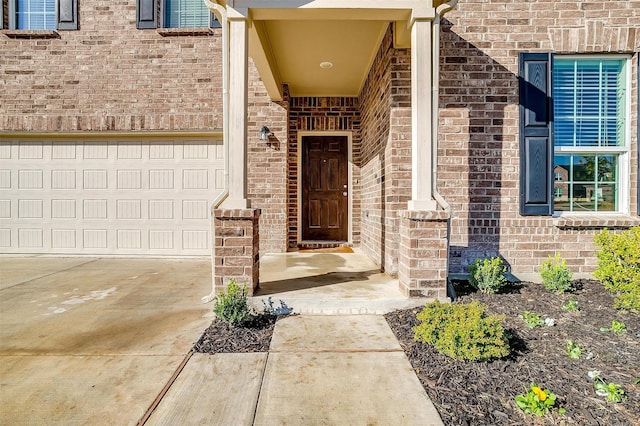 9113 Redshire Ln, Fort Worth, TX 76131 - doorway to property with brick siding, a garage, and driveway