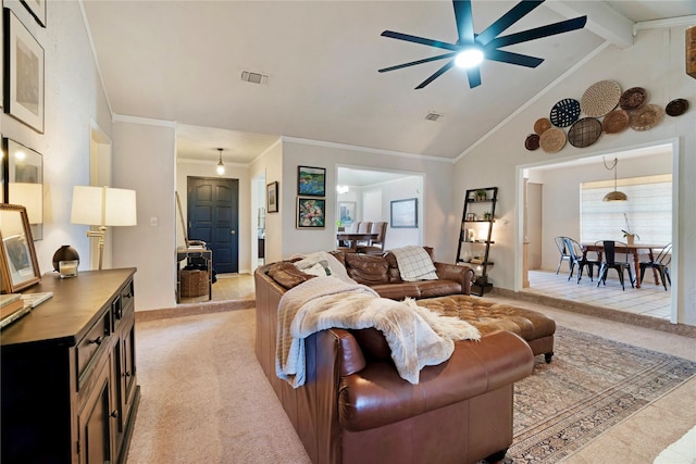 living area featuring light carpet, vaulted ceiling with beams, visible vents, and ornamental molding