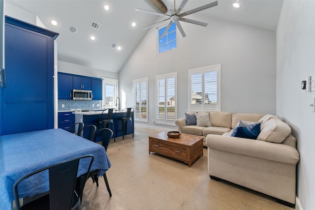 living area featuring concrete flooring, ceiling fan, high vaulted ceiling, recessed lighting, and visible vents