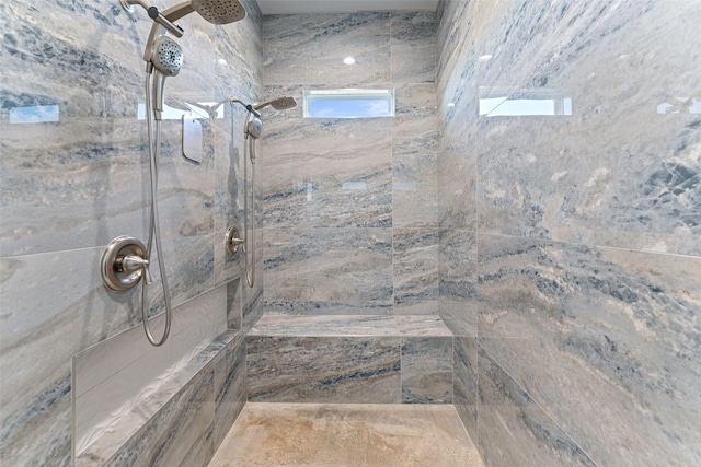 bathroom featuring a tile shower