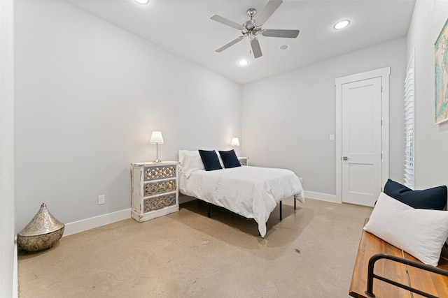 bedroom with baseboards, concrete flooring, and recessed lighting