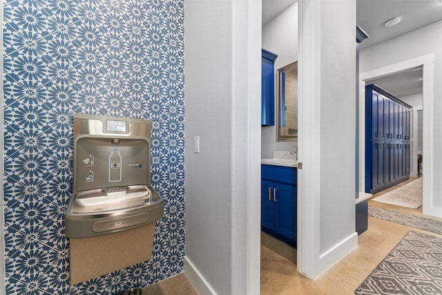 bathroom with baseboards and vanity