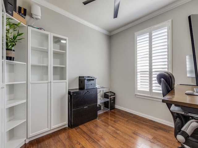 home office with ornamental molding, dark wood finished floors, baseboards, and a ceiling fan