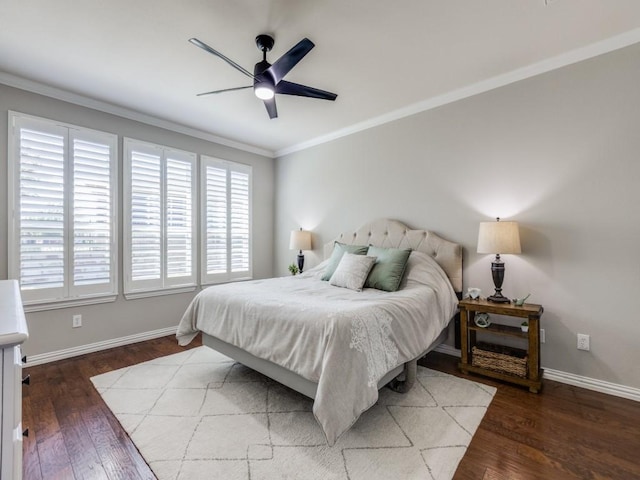 bedroom with ornamental molding, wood finished floors, a ceiling fan, and baseboards