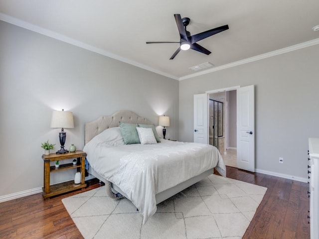 bedroom with ornamental molding, hardwood / wood-style flooring, and baseboards