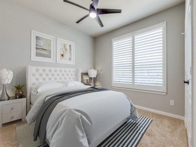 bedroom with ceiling fan and baseboards