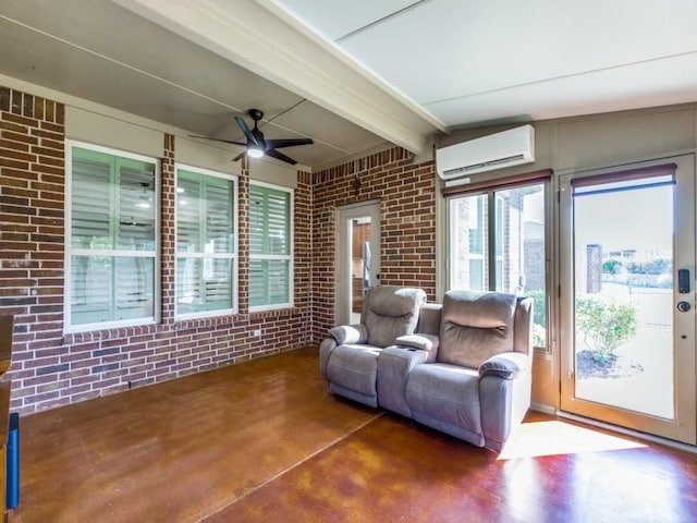 living room featuring a wall unit AC, brick wall, finished concrete floors, and beam ceiling