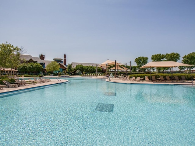 community pool with a patio area