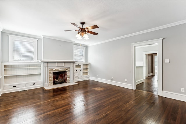 unfurnished living room with baseboards, visible vents, ornamental molding, hardwood / wood-style floors, and a fireplace