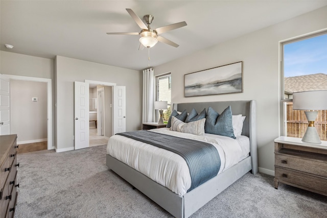 bedroom with carpet flooring, a ceiling fan, and baseboards