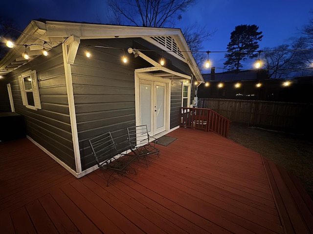 deck at twilight with fence