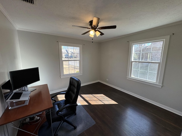 unfurnished office with a textured ceiling, a ceiling fan, baseboards, dark wood-style floors, and crown molding