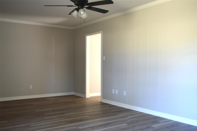 unfurnished room with crown molding, baseboards, ceiling fan, and dark wood-type flooring