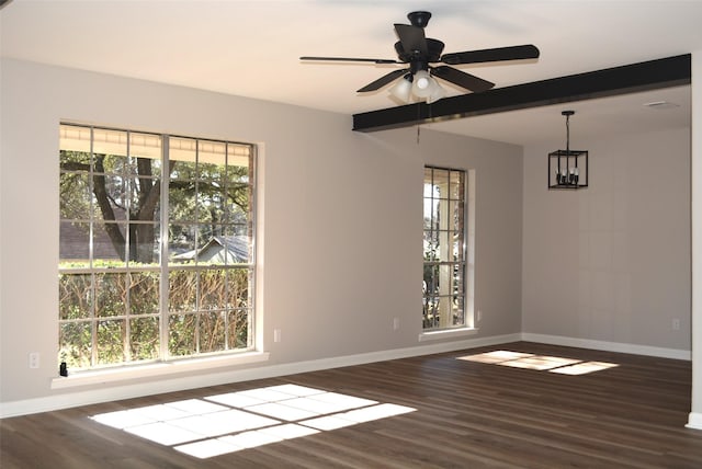 unfurnished room featuring beam ceiling, wood finished floors, a ceiling fan, and baseboards