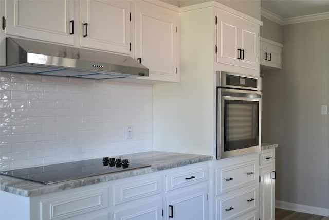 kitchen with backsplash, ornamental molding, stainless steel oven, under cabinet range hood, and black electric cooktop