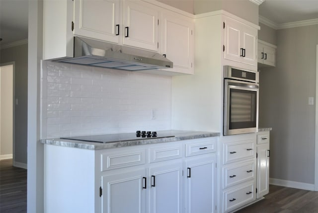 kitchen with crown molding, dark wood finished floors, oven, and under cabinet range hood