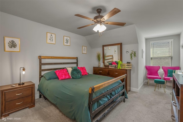 bedroom with baseboards, carpet floors, lofted ceiling, and a ceiling fan