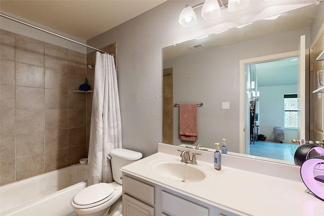 bathroom featuring a textured wall, toilet, visible vents, vanity, and shower / bath combo