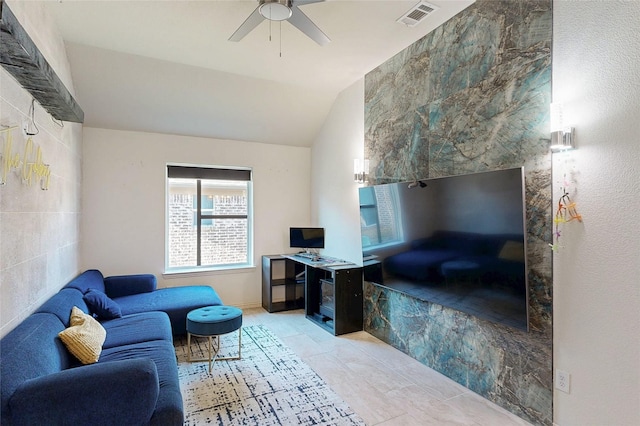 interior space featuring vaulted ceiling, visible vents, and a ceiling fan