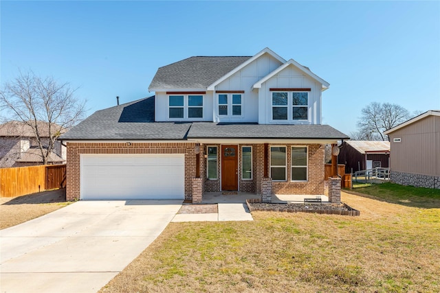 view of front of home with driveway, an attached garage, fence, a front lawn, and brick siding