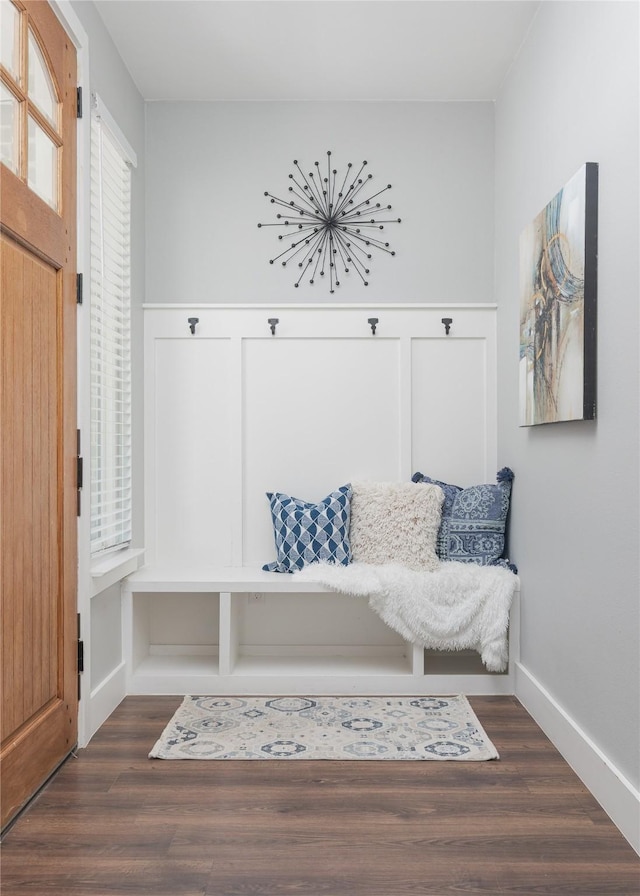 mudroom with dark wood finished floors