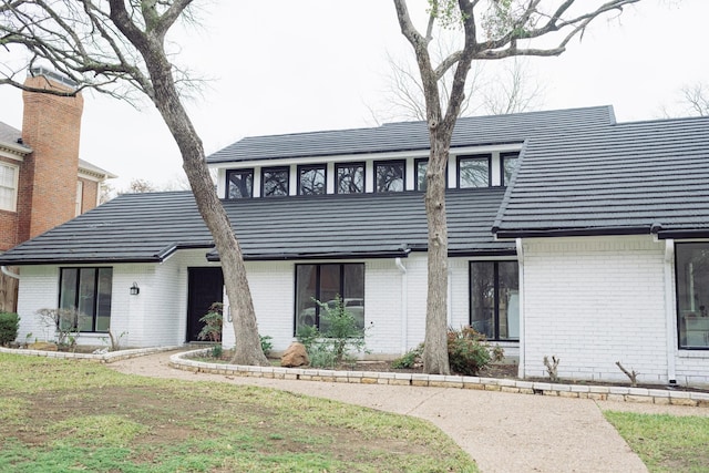 view of front of home featuring brick siding