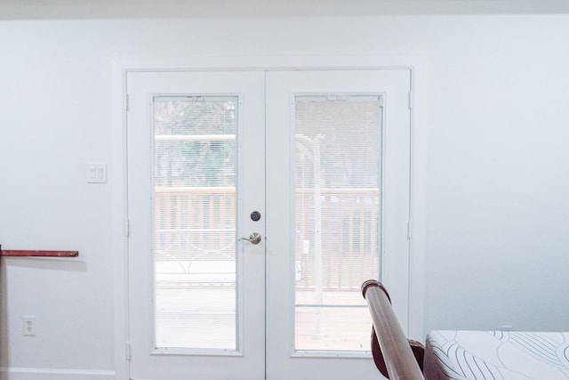 doorway with a wealth of natural light and french doors