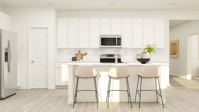 kitchen with fridge with ice dispenser, range, and white cabinets