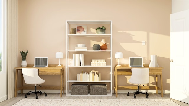 office area with wood finished floors and baseboards