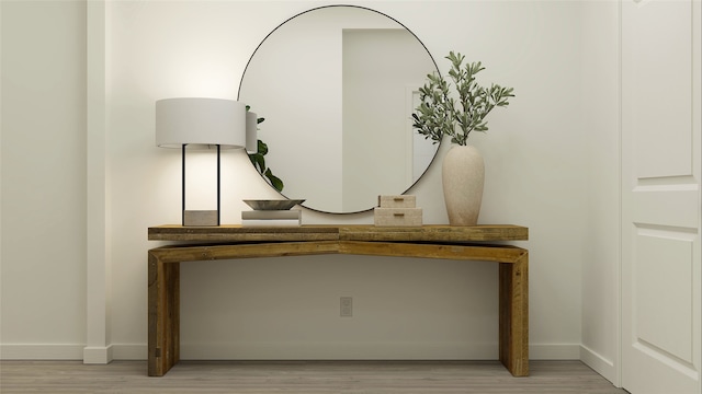 interior details featuring wood finished floors and baseboards