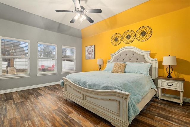 bedroom featuring dark wood-style floors, ceiling fan, vaulted ceiling, and baseboards